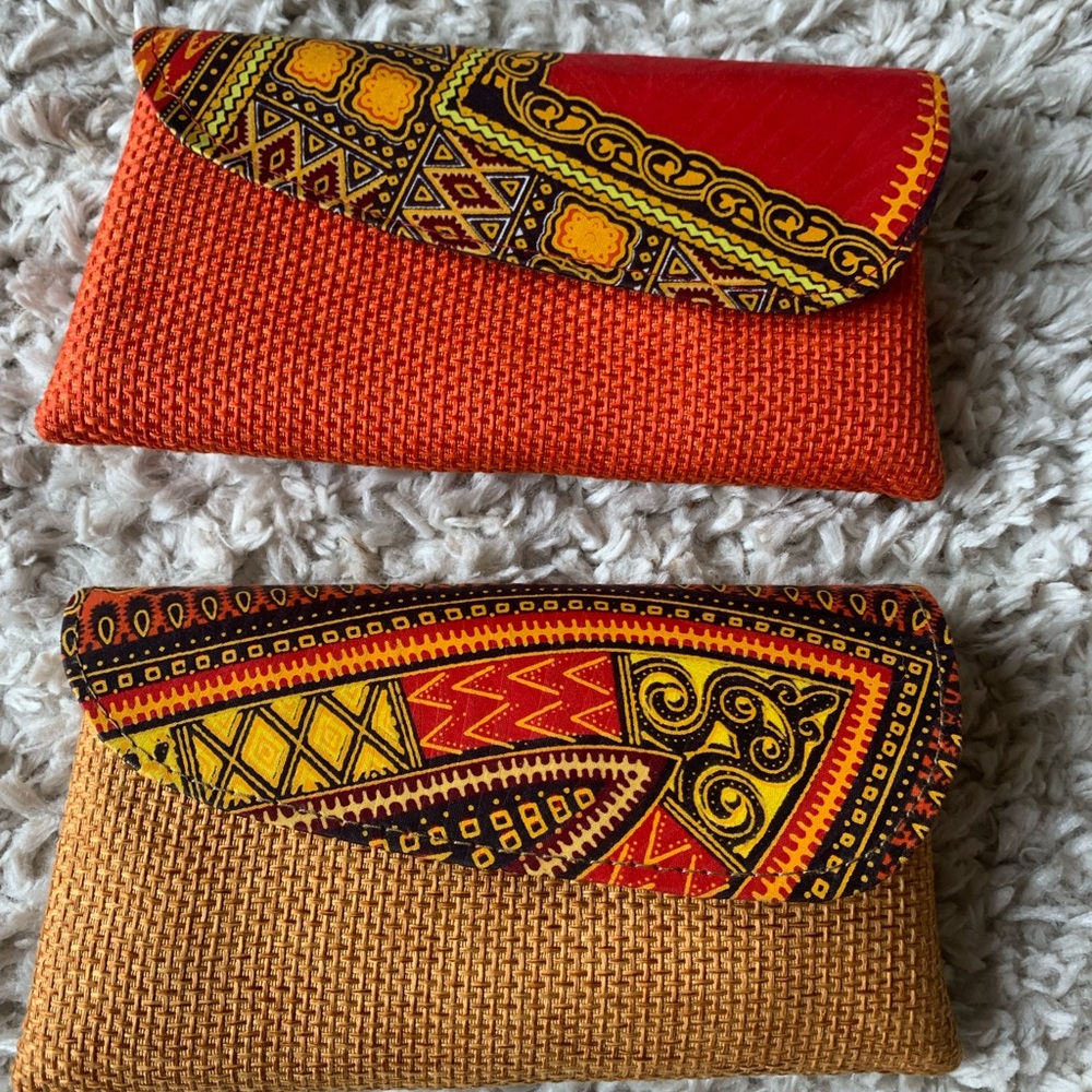 (2) Kenyan/ African fabric clutch handbags. Durable material in great colors.